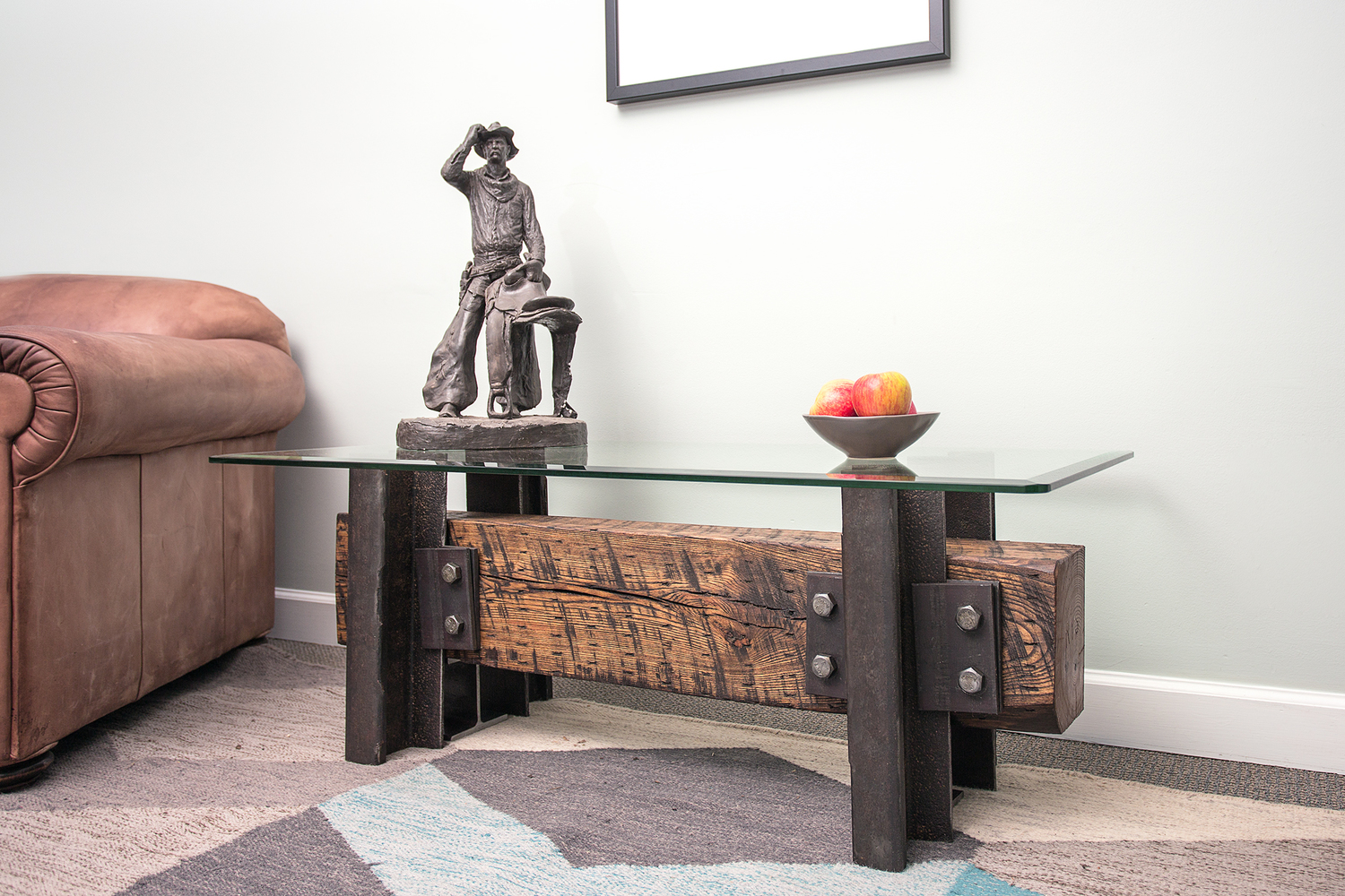 wood-steel-coffee-table-cowboy-statue-leather-chair